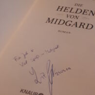 Autogramm Liza Grimm im Buch "Die Helden von Midgrad"